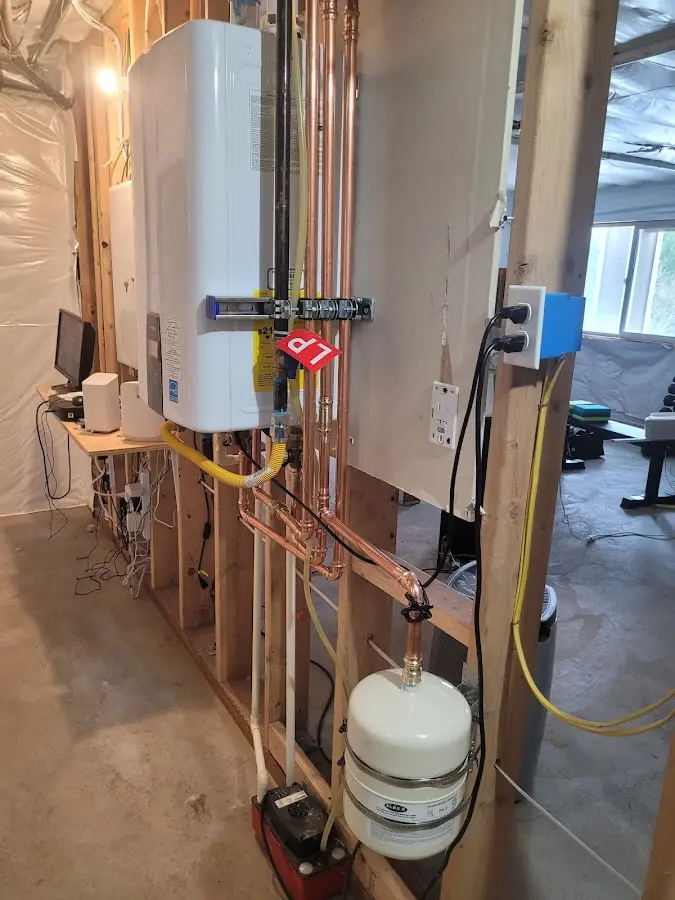 Licensed plumber repairing a kitchen sink in Cold Spring